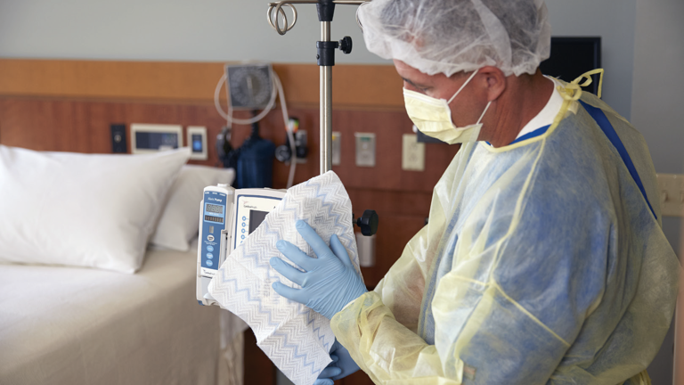 Hospital staff cleaning Alaris Infusion Pump with HYGEN™ Disposable Microfibre Cloth