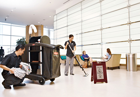 Cleaning staff at work using Rubbermaid Cart and Mops